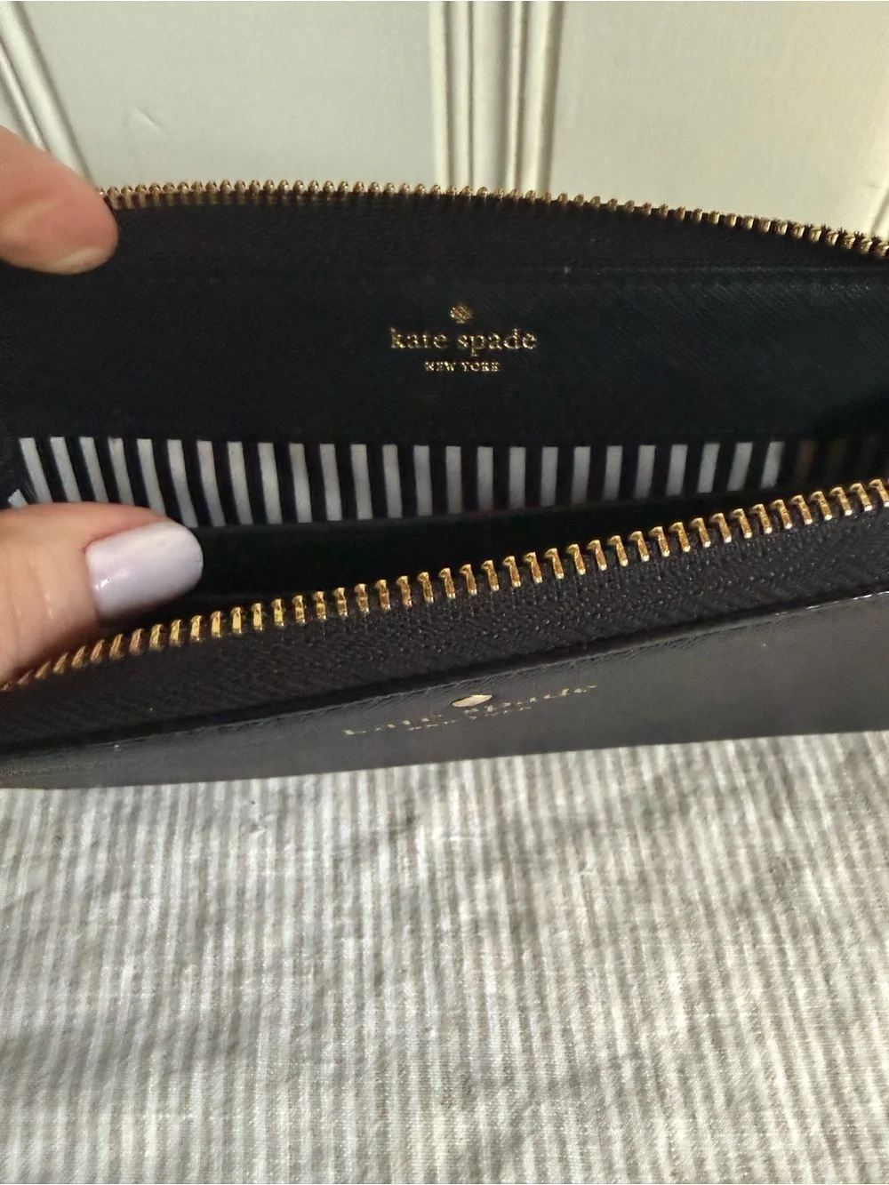 kate spade black zip-around wristlet wallet with gold logo